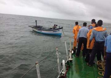 watch how coast guard rescued two indian crew of fishing boat near lakshadweep view pics