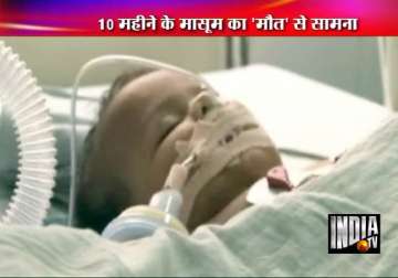 10 month old battling for life after falling in water bucket