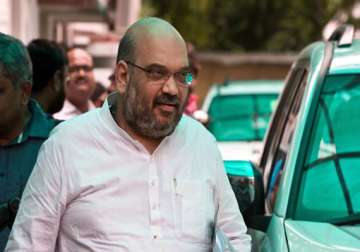 aap demands action against amit shah