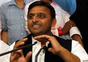 akhilesh defends vadra calls modi a model of dividing india