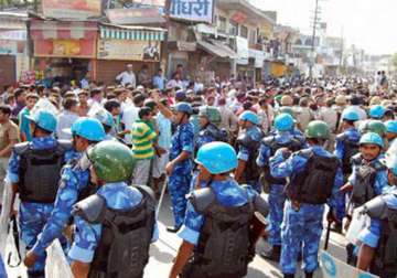 bjp criticises minister over blame for muzaffarnagar riots