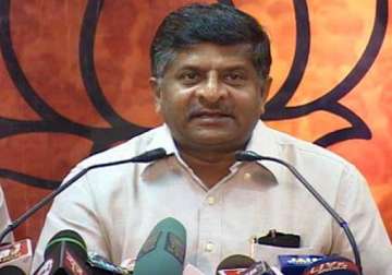 bjp demands resignation of pm removal of law minister