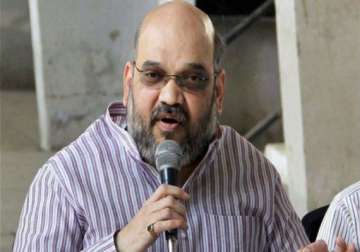 bjp seeks review by ec on ban order against amit shah