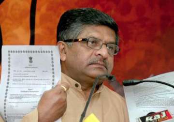 bjp blames pm s conspiracy of silence for graft