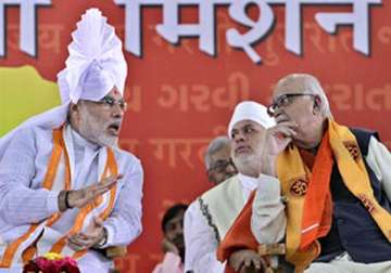 bjp leaders downplay absence of modi from national executive