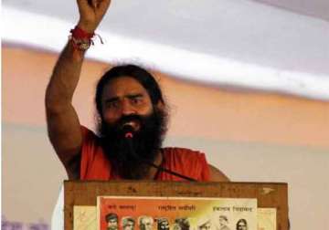 bihar minister slaps ramdev with case