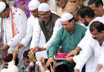 chouhan dons skull cap as he greets muslims on eid