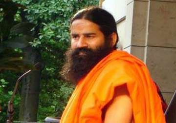 congress gandhi family looting india says swami ramdev