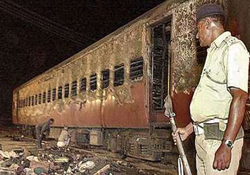 deeply divided godhra braces for poll
