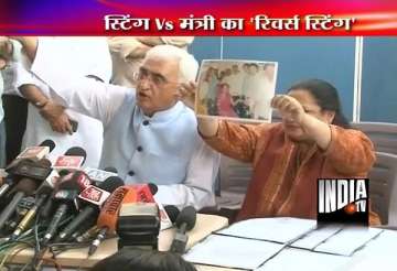 khurshid shows pictures documents to prove camps were held
