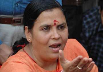 if pm sonia can attend dussehra event why can t i uma bharti asks ec