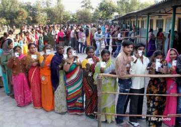 record 67.14 pc voting in delhi exit polls predict aap win