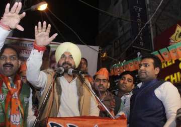 delhi polls on campaign trail for bjp sidhu pushes buy one get one free offer