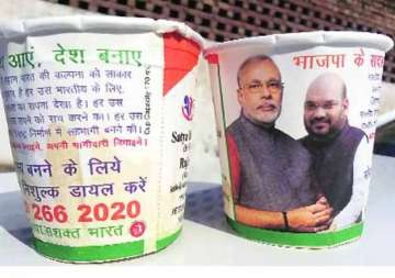 bjp taking chai pe charcha in trains with images of modi and shah on cups