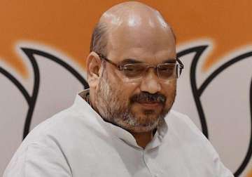 modi s a non corrupt govt says amit shah asks cong to name at least one scam