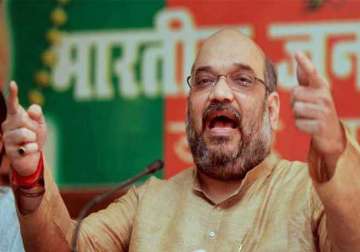 amit shah launches offensive against congress govt in karnataka