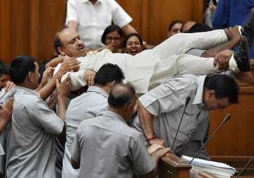 all 3 bjp mlas marshalled out of delhi assembly