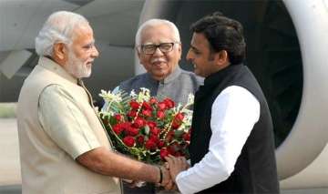 akhilesh praises modi is sp going soft on bjp