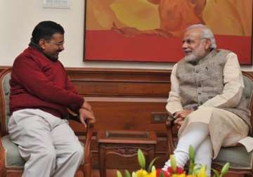 delhi cm designate kejriwal meets pm modi invites him for swearing in