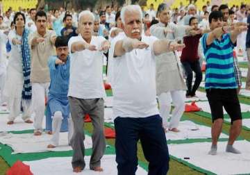 donning tracksuit haryana cm manohar lal khattar performs yoga asanas