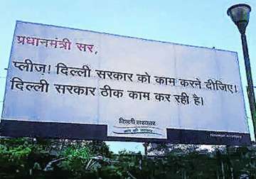 aap govt removes posters hoardings critical of pm modi