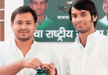 lalu s sons take charge as ministers