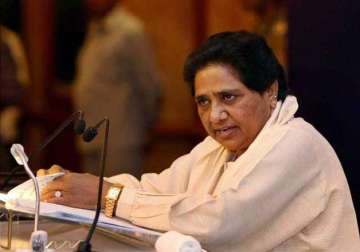 will you chop off your head now an unconvinced mayawati asks smriti irani