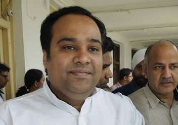 kejriwal sacks minister asim ahmed over corruption charges