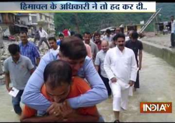 himachal congress leader reviews flood situation riding on the back of officials