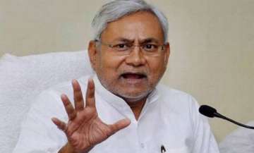 be on guard against politics of communal frenzy nitish