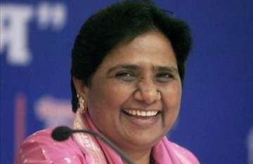 mayawati lashes out at centre over right to education act