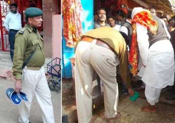 lalu s dabangg style dsp washes feet police constable carries slippers