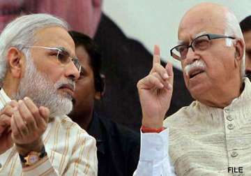 modi showers praise on advani asks bjp workers to ensure his victory