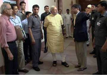 modi walks through pmo posts picture