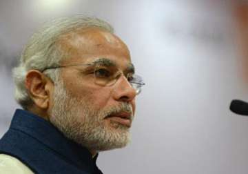 modi welcomes advani s decision to stay on