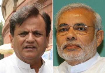 modi trying to play communal card by naming ahmed patel says congress