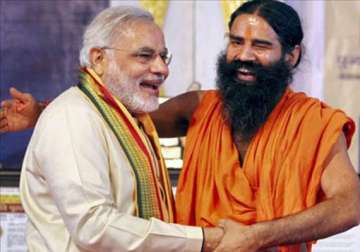 no riot in gujarat in last 12 years says modi from ramdev s dais