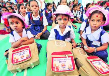 schoolbags with atal modi photos distributed in vadodara