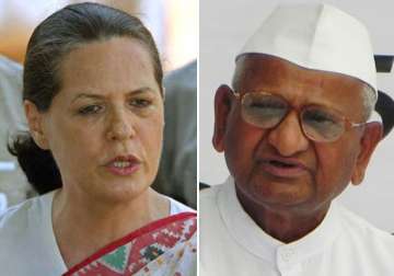 sonia gandhi defends pm describes team anna s charges as conspiracy