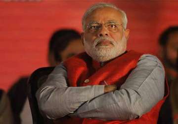 stars do not favour modi as pm a woman or an old man will become pm says astrologer