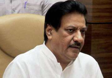 youth held for trying to hurl slipper at maharashtra cm