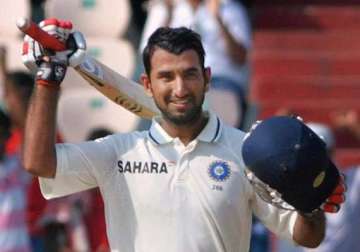 pujara hits his maiden double ton yuvraj out for 74