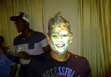 dhoni posts pic of birthday cake all over his face