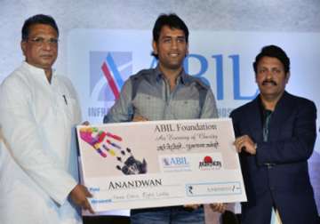 dhoni hands over rs 3 cr to baba amte s ngo