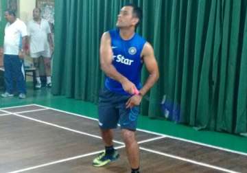 in pics ms dhoni sweats it out at badminton court