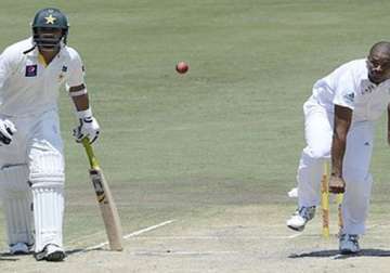 pakistan holds back the tide but still 166 behind