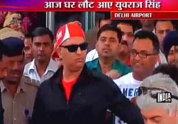recovering yuvraj returns to warm welcome