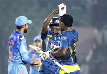 sangakkara hits ton as sri lanka beat india by 2 wickets