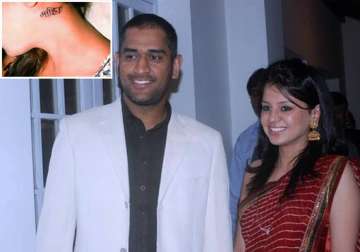 wife sakshi gets mahi tattoo on her neck