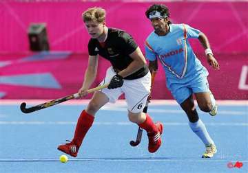 champions hockey india lose to germany but top group